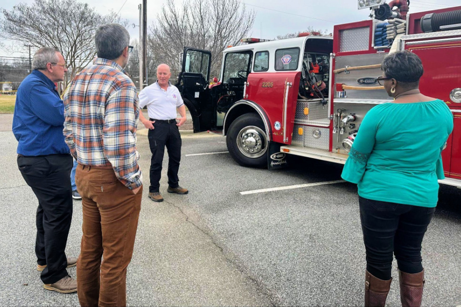 Mocksville Fire Chief Frank Carter shares the department’s equipment needs with (L to R) Commissioner Carl Lambert, Mayor Will Marklin, and Commissioner Jenny Stevenson. 